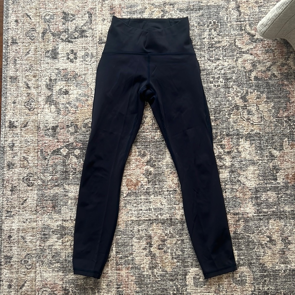 Lululemon side mesh leggings. Fast and free material. Color navy. Size 4